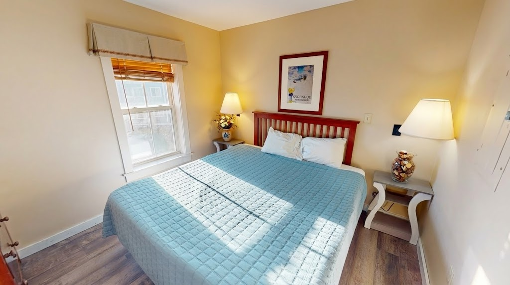Rest easy: serene primary with a plush king bed and soft linens.