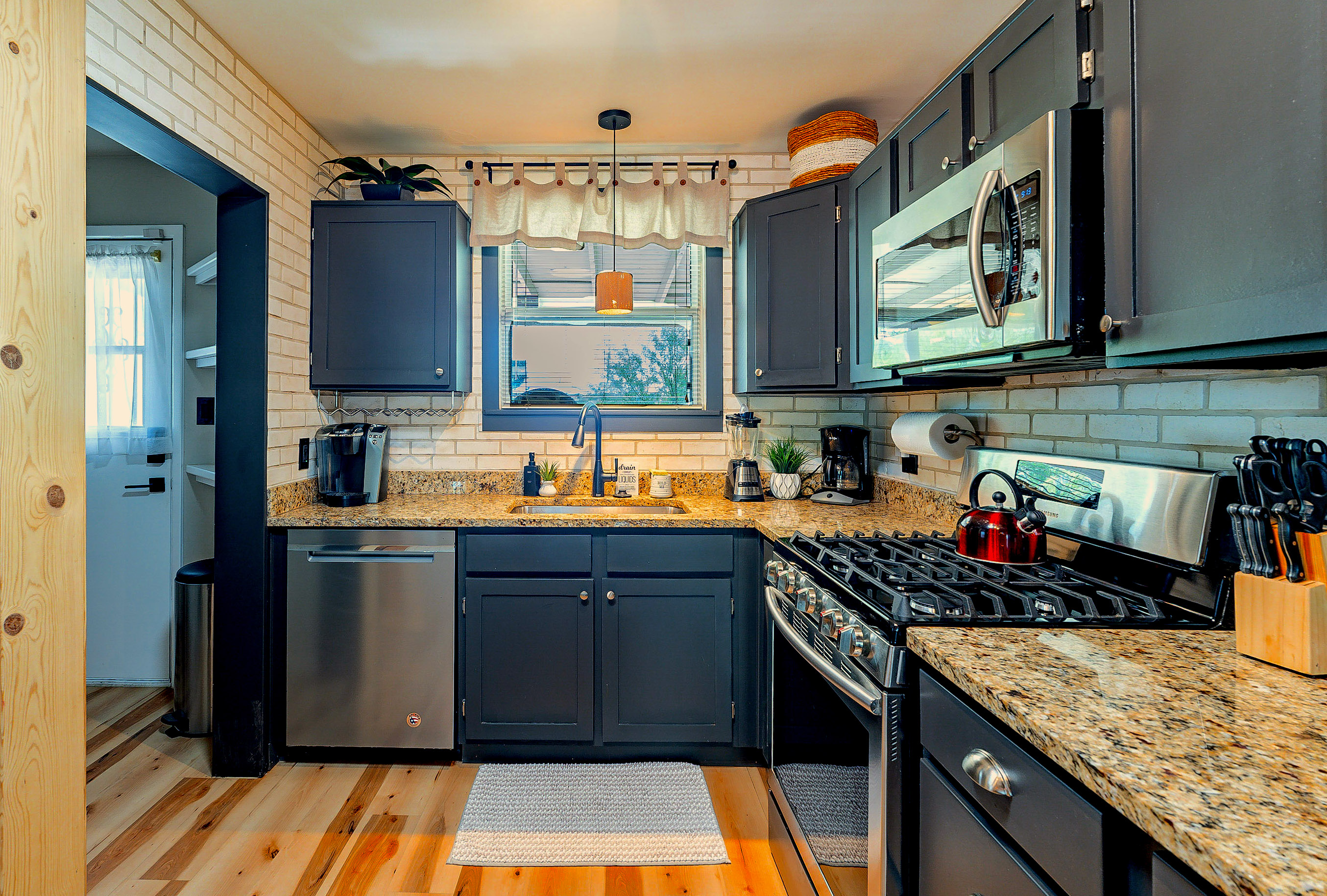 Kitchen: Whip up culinary delights in this modern space with stylish granite countertops!