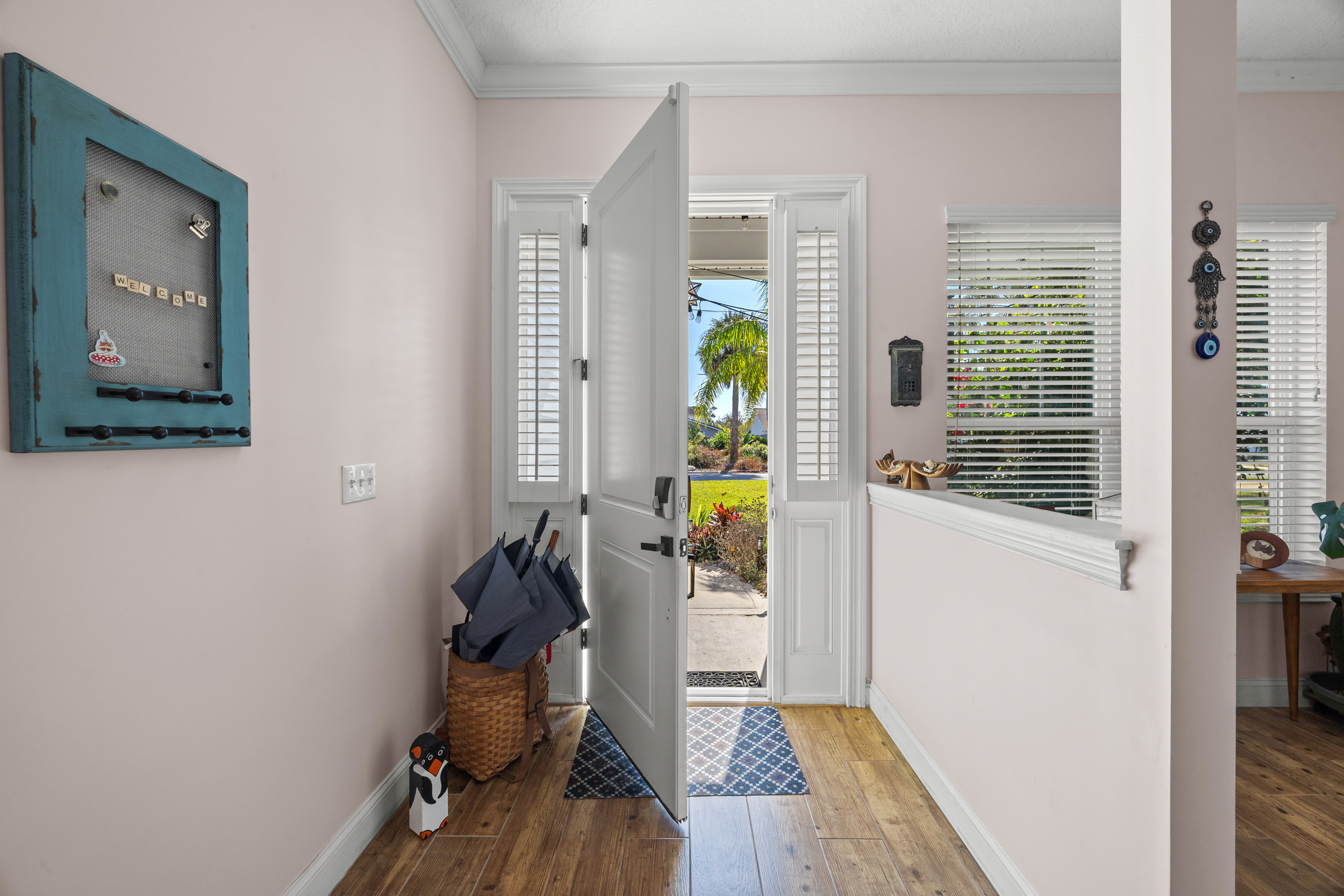 Sunny, welcoming entryway with tropical views — a bright start to your beach vacation.