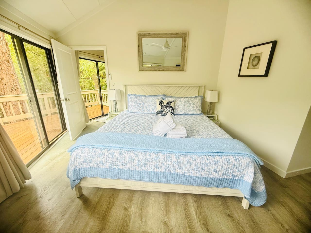 Queen bedroom with deck doors