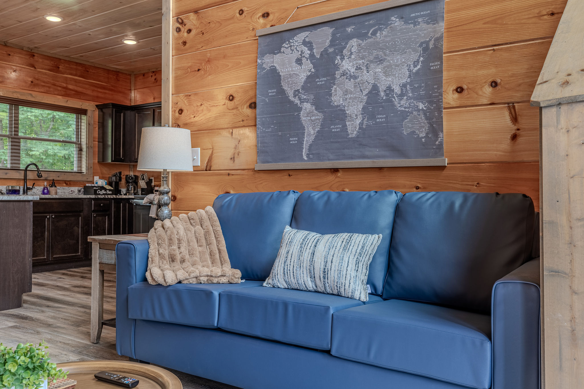 Warm wood walls and cozy seating give the living room its classic Smoky Mountain feel.