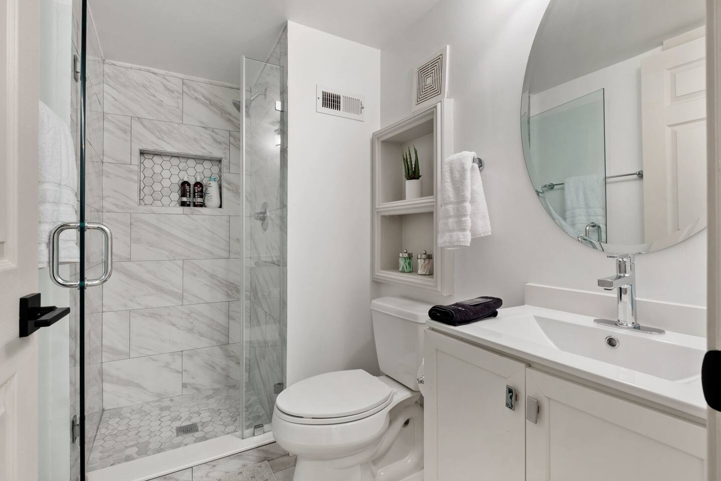Modern, crisp, newly renovated bathroom. 