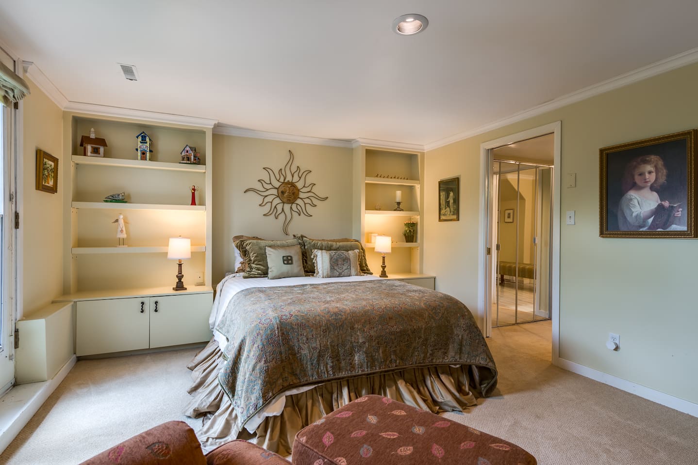 Master bedroom (queen bed).  It is located downstairs along with one other bedroom.  It is a lovely peaceful room.   It has double French doors leading into the garden and has an adjoining master bathroom.