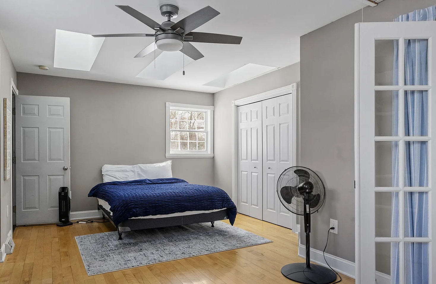 This versatile office-bedroom combo offers a double bed, spacious closet, desk + chair, and convenient location near the bunk room for added flexibility.