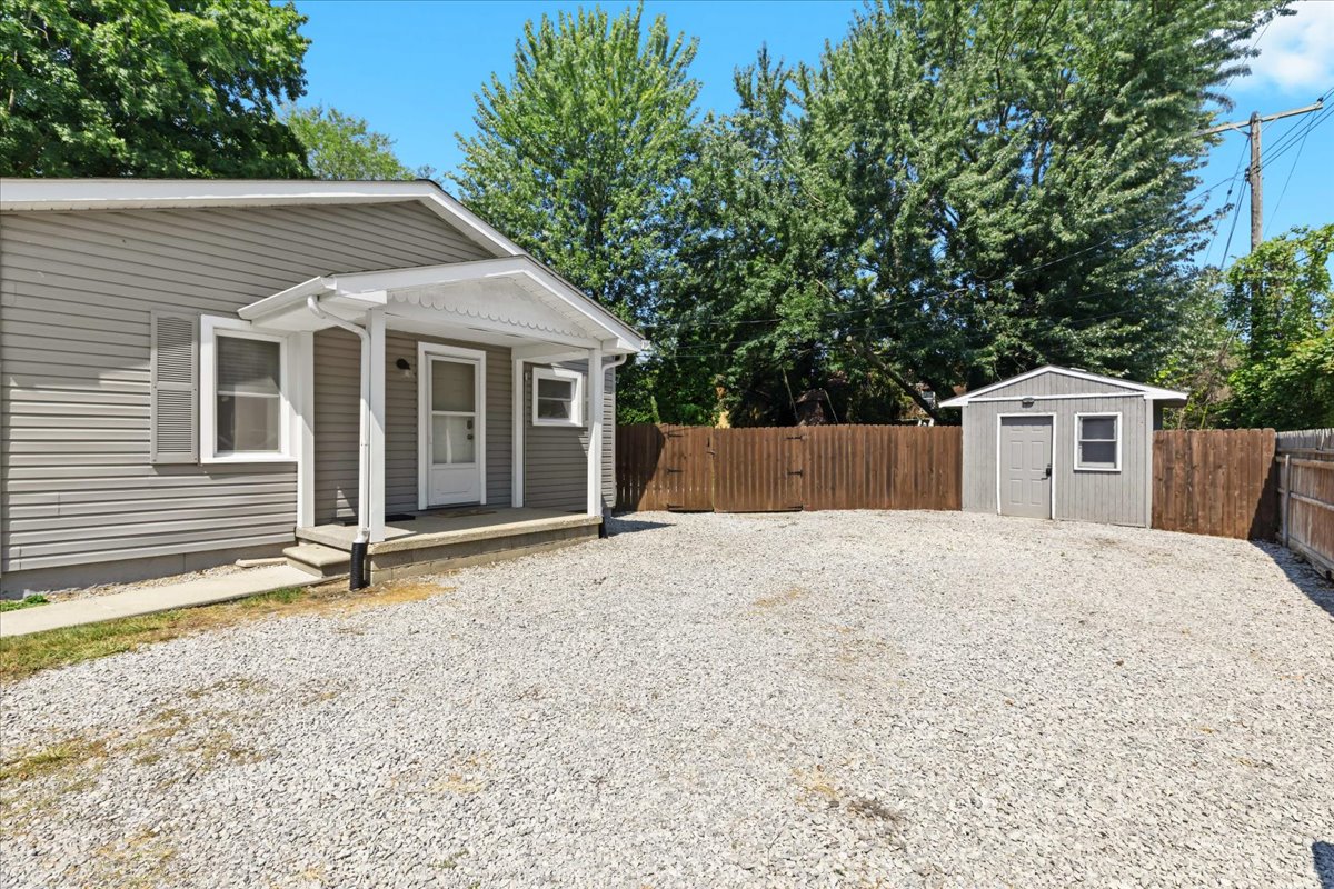 Rear home view with expansive fenced green space