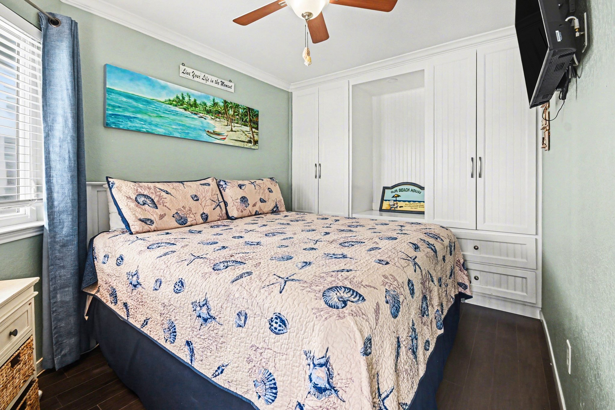 Primary bedroom with king bed and tv