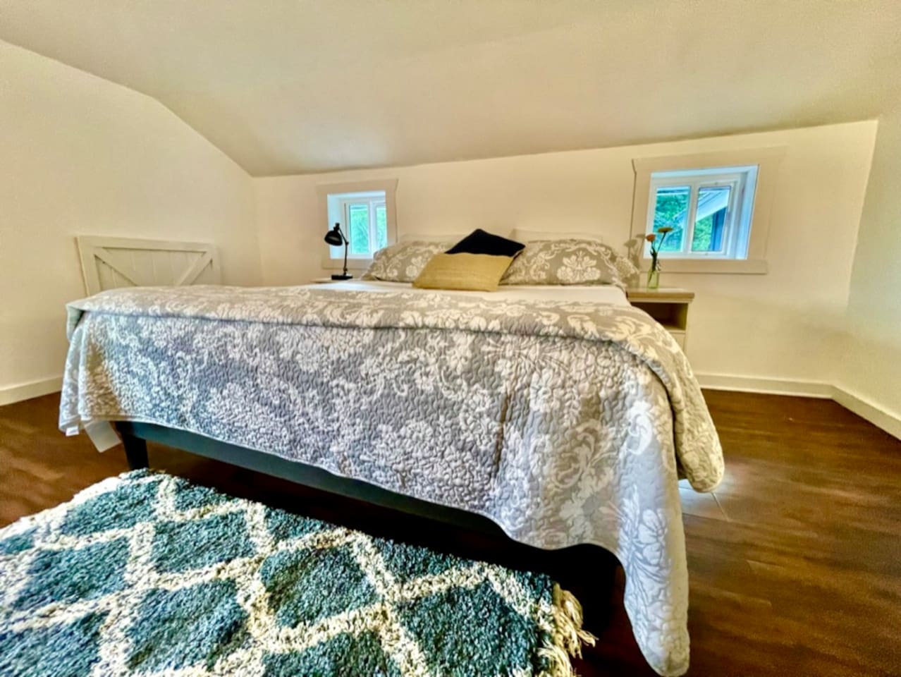 Cotton sheets and comfy mattress on King bed in upstairs bedroom. Blackout curtains for sound sleep. 