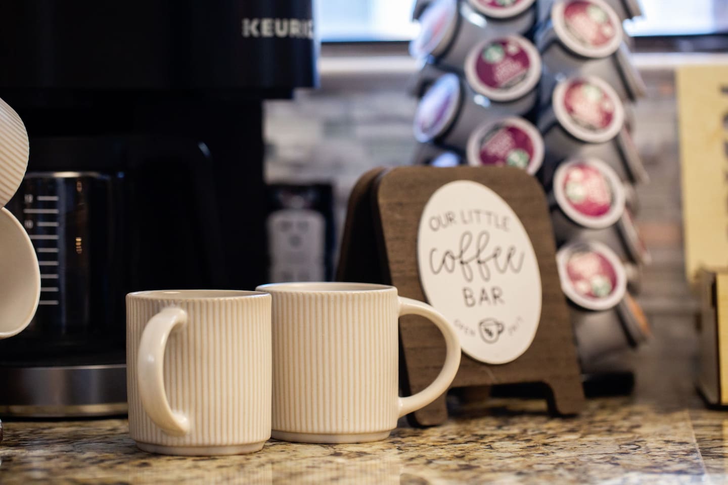 ☕ Start your mornings right at the coffee bar—stocked with K-cups, mugs, and everything you need for a quick brew before a busy day at a conference, campus tour, theme park, or military base visit.