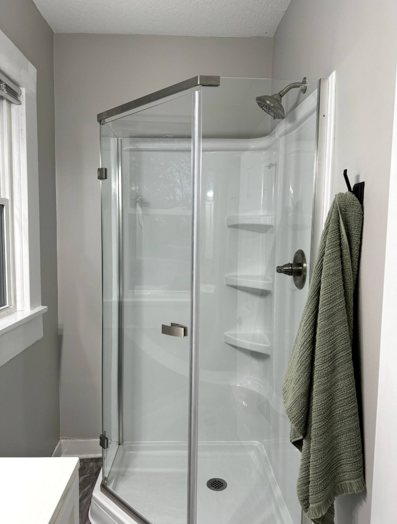 Rinse off in a sleek, spacious glass shower after a full day of exploring.