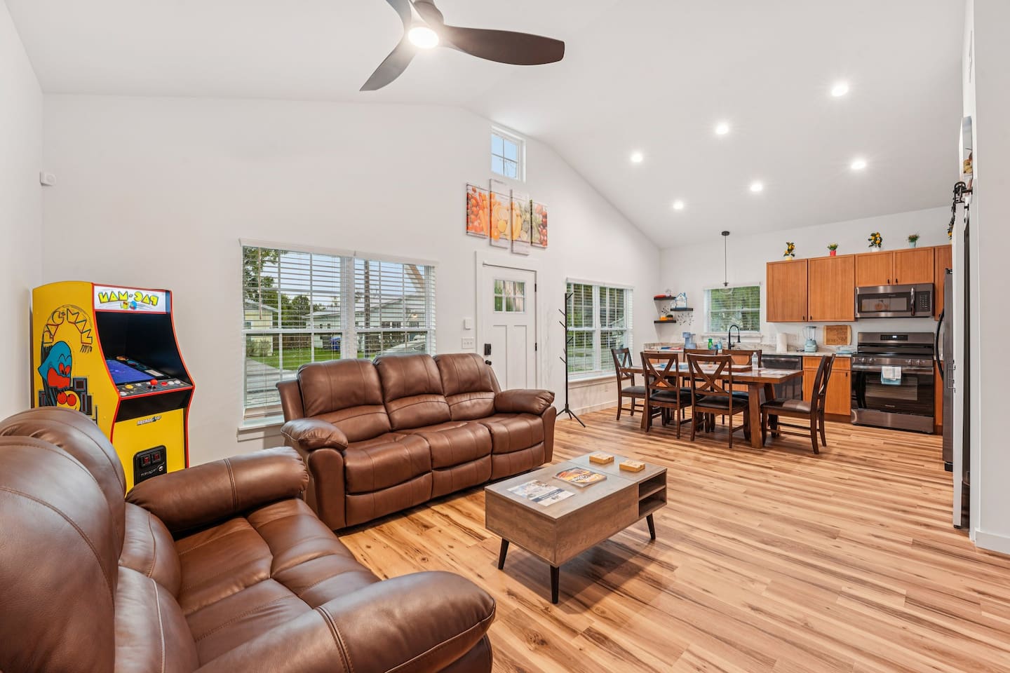 Comfortable reclining sofas, full-size Pacman arcade game (with Galaga and many other games) coffee table lifts up, board games in table.