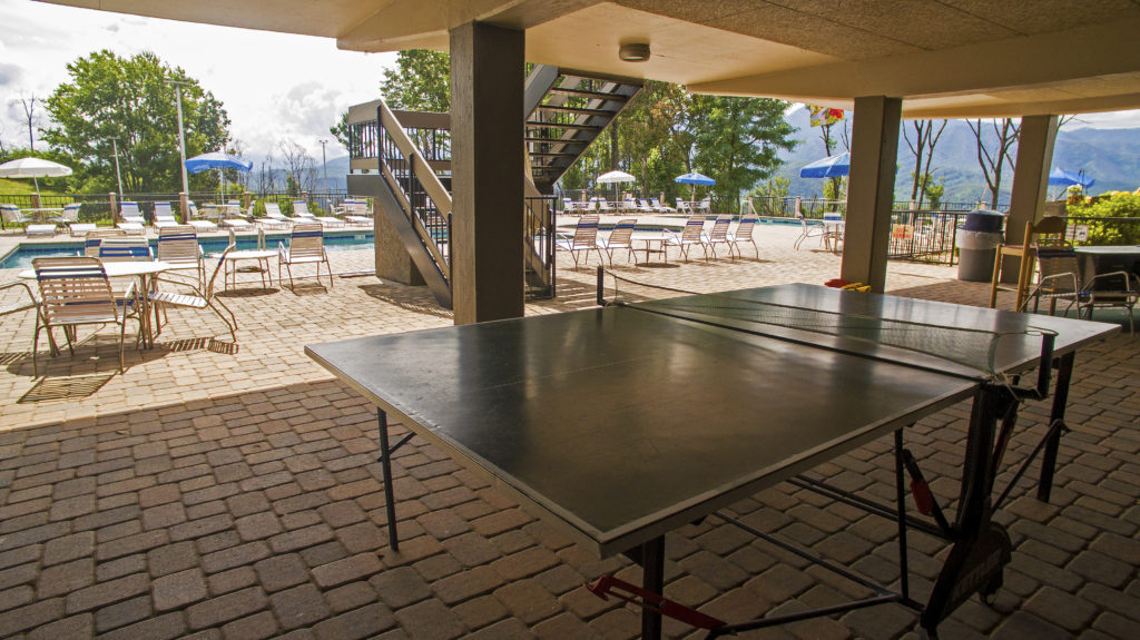 The North Clubhouse, one of three pool areas you will have access to during season features beautiful views, sunny double pools along with tennis, pickleball and ping pong recreation areas.