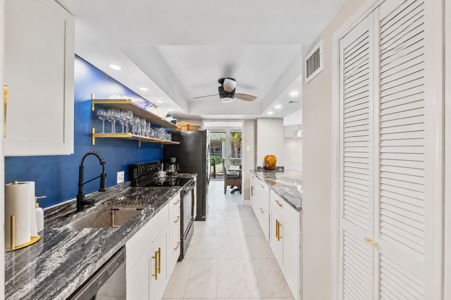 Fully stocked kitchen with cookware, plates, utensils, and all your dining essentials — plus a refrigerator with built-in ice maker and water filter.