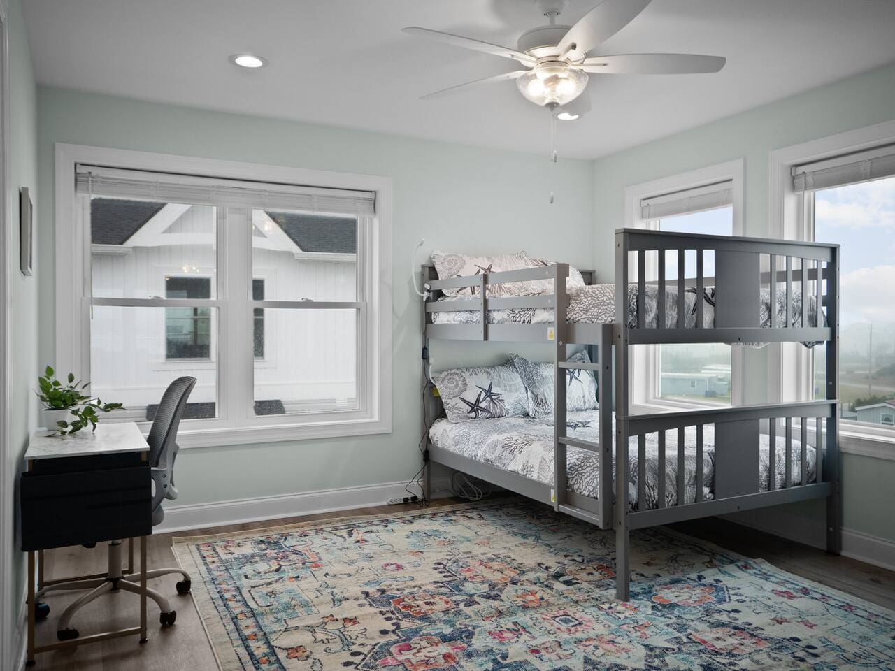 Full bunkbeds on third floor with desk