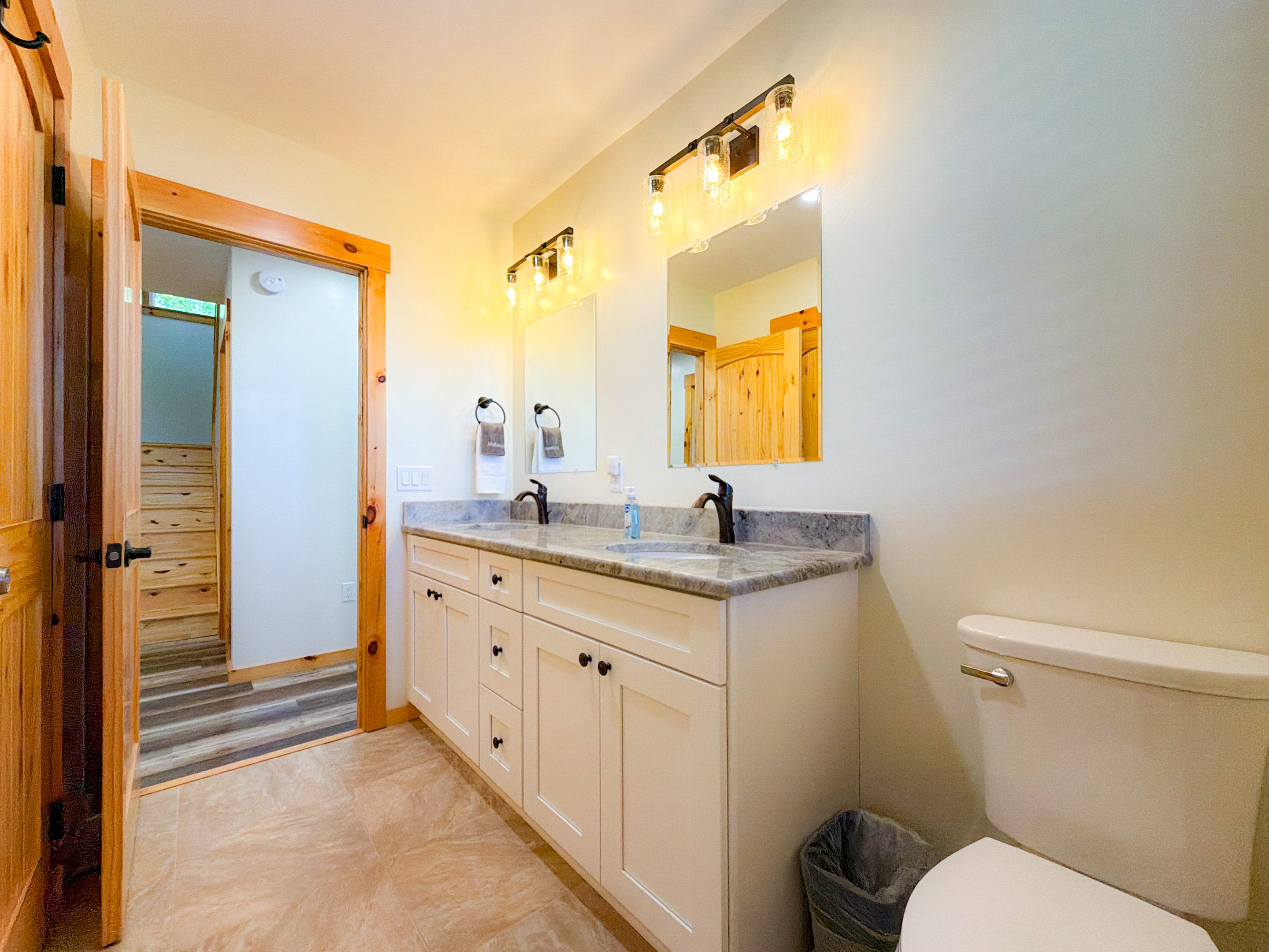 Guest Bathroom 1 on the Lower level. Full bathroom with tile shower and double vanity.