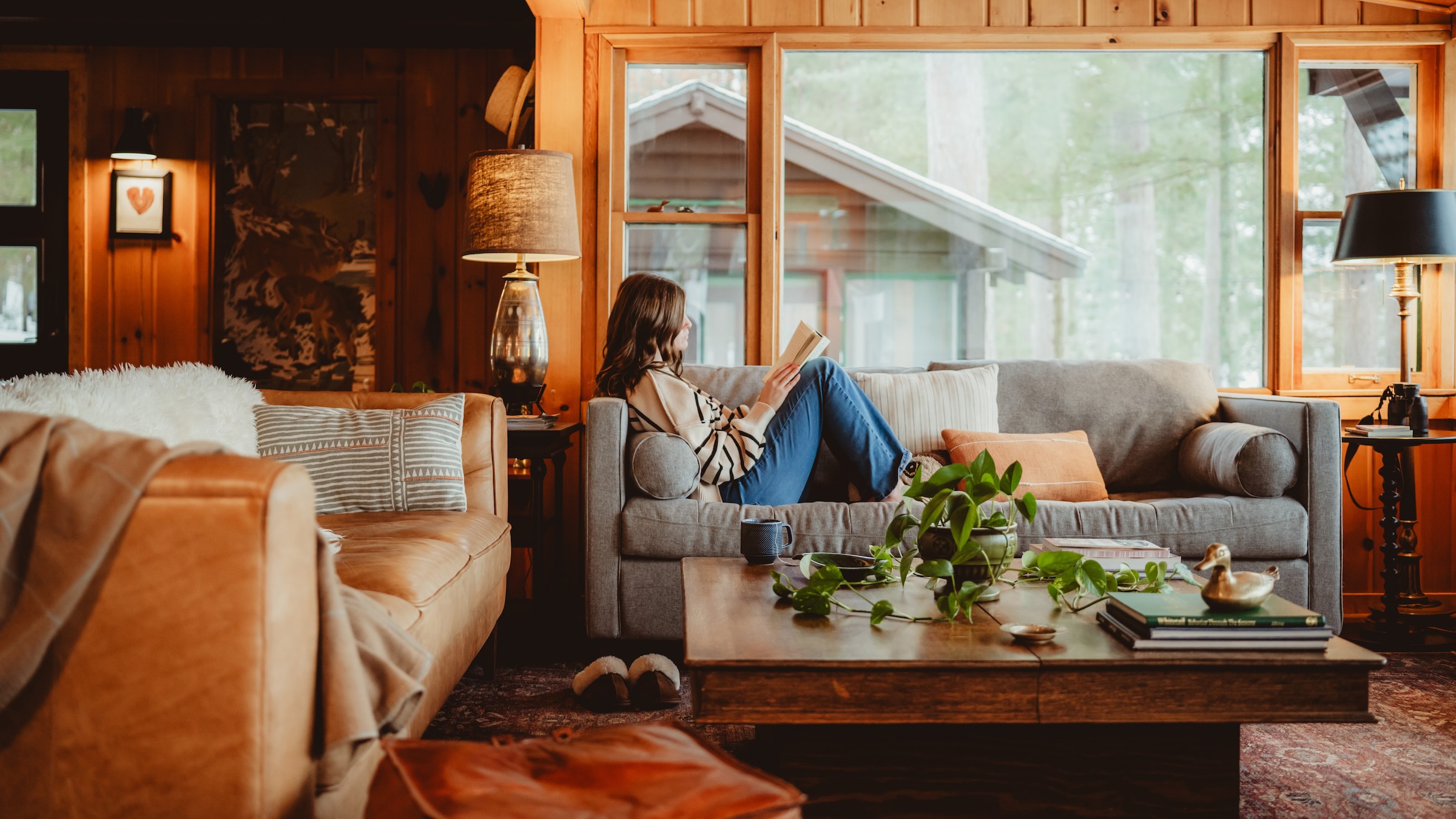 Girl reading a good book in the living room at Dollar Lake Retreat
