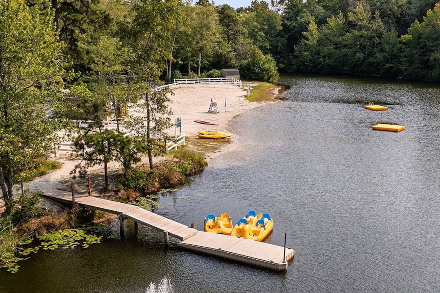 Swimming lake with kayak and paddle boat rentals. 