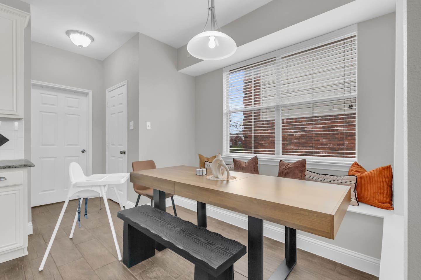 Inviting breakfast nook located just off the kitchen, offering a comfortable space for relaxed group dining.