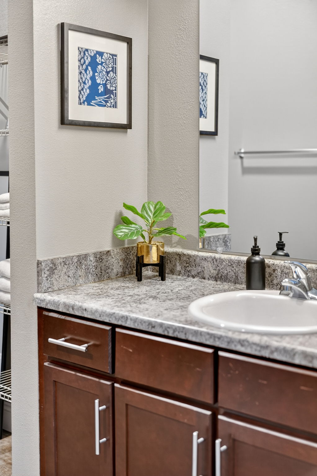 The primary bathroom has plenty of storage in the vanity; use the drawers or cabinets.