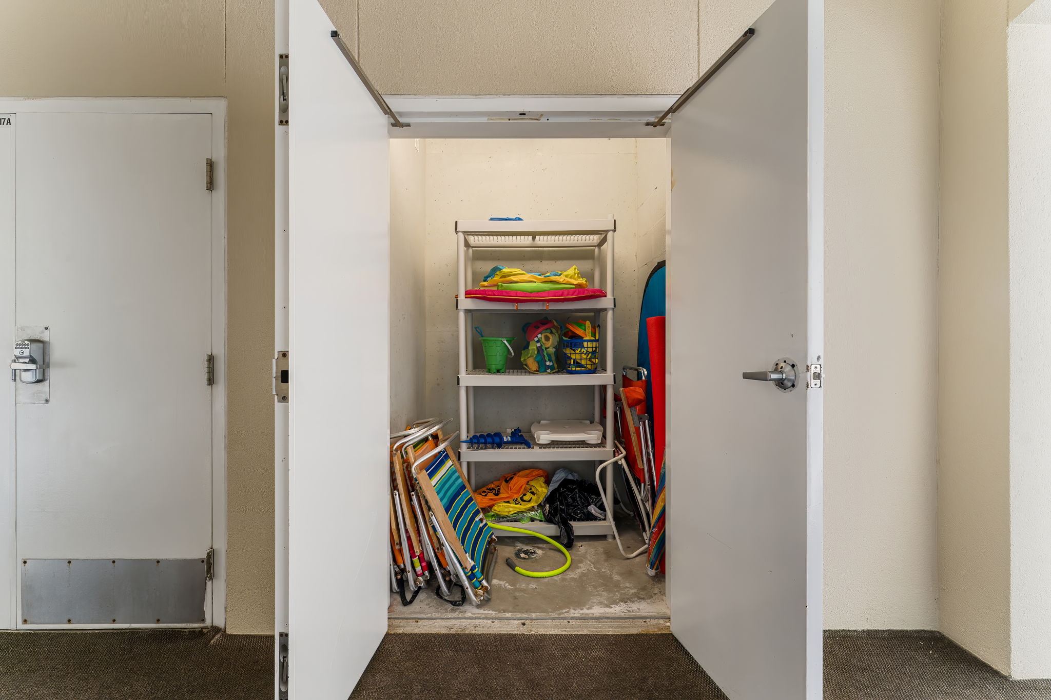 Beach chair and toys closet with its own hose right outside our unit!