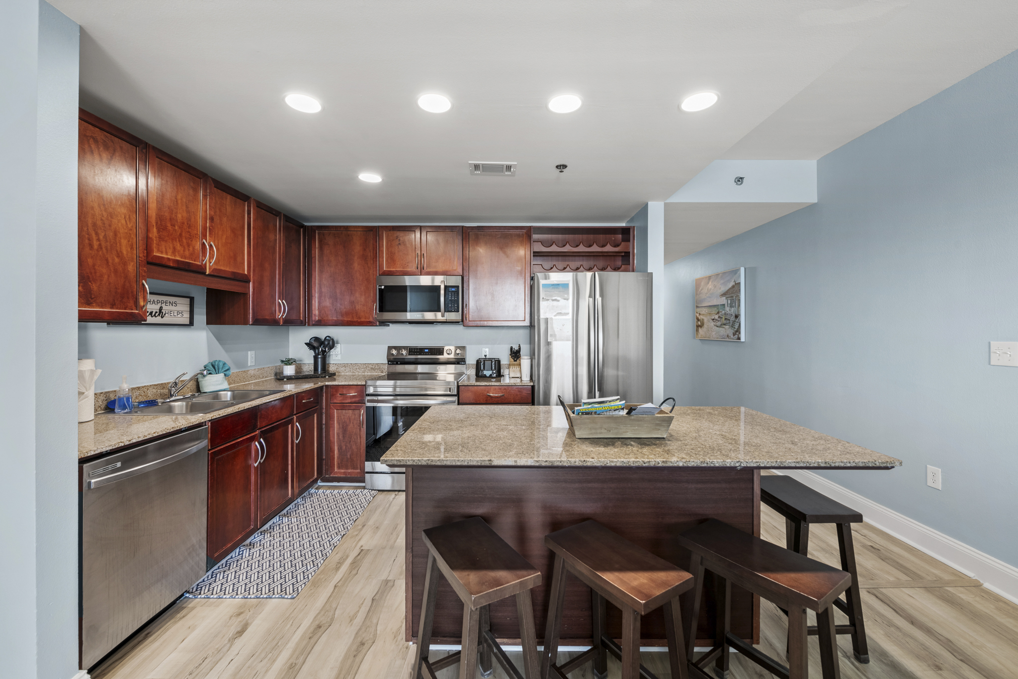 Refrigerator has a built in ice make with bin in the lower drawer.