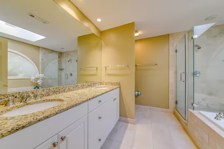 Double Queen Bathroom also features dual sinks and walk-in shower