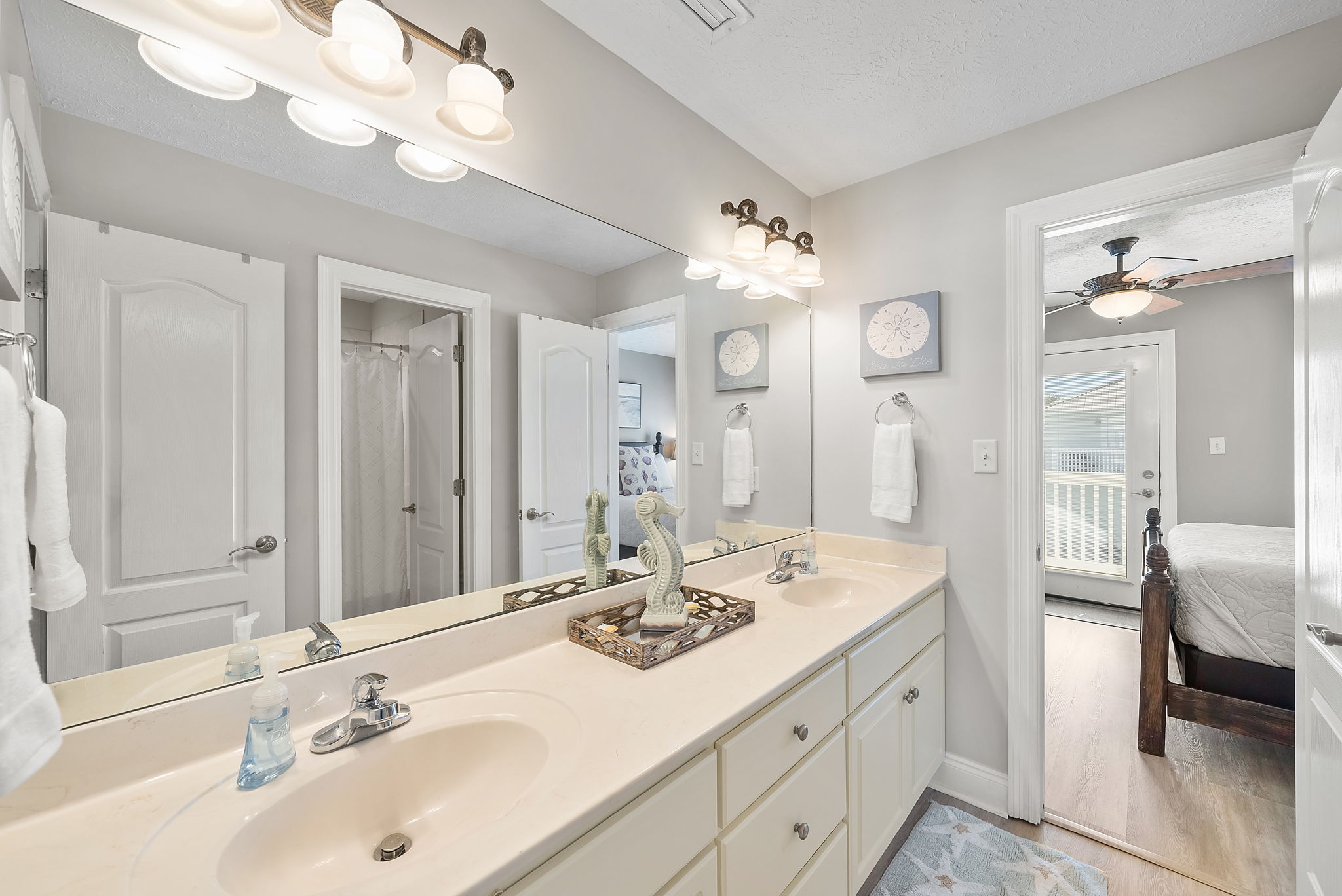 Two sinks plus a separate shower area makes this bathroom perfect for multiple people getting ready.