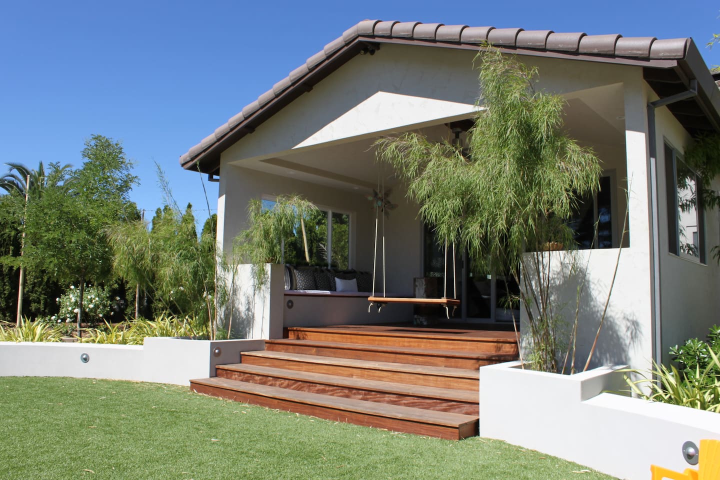 Swing away on the outdoor porch overlooking acres of land