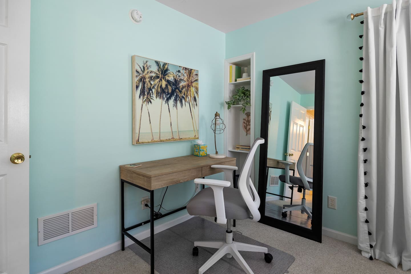 Workspace with adjustable office chair, on rolling mat. 