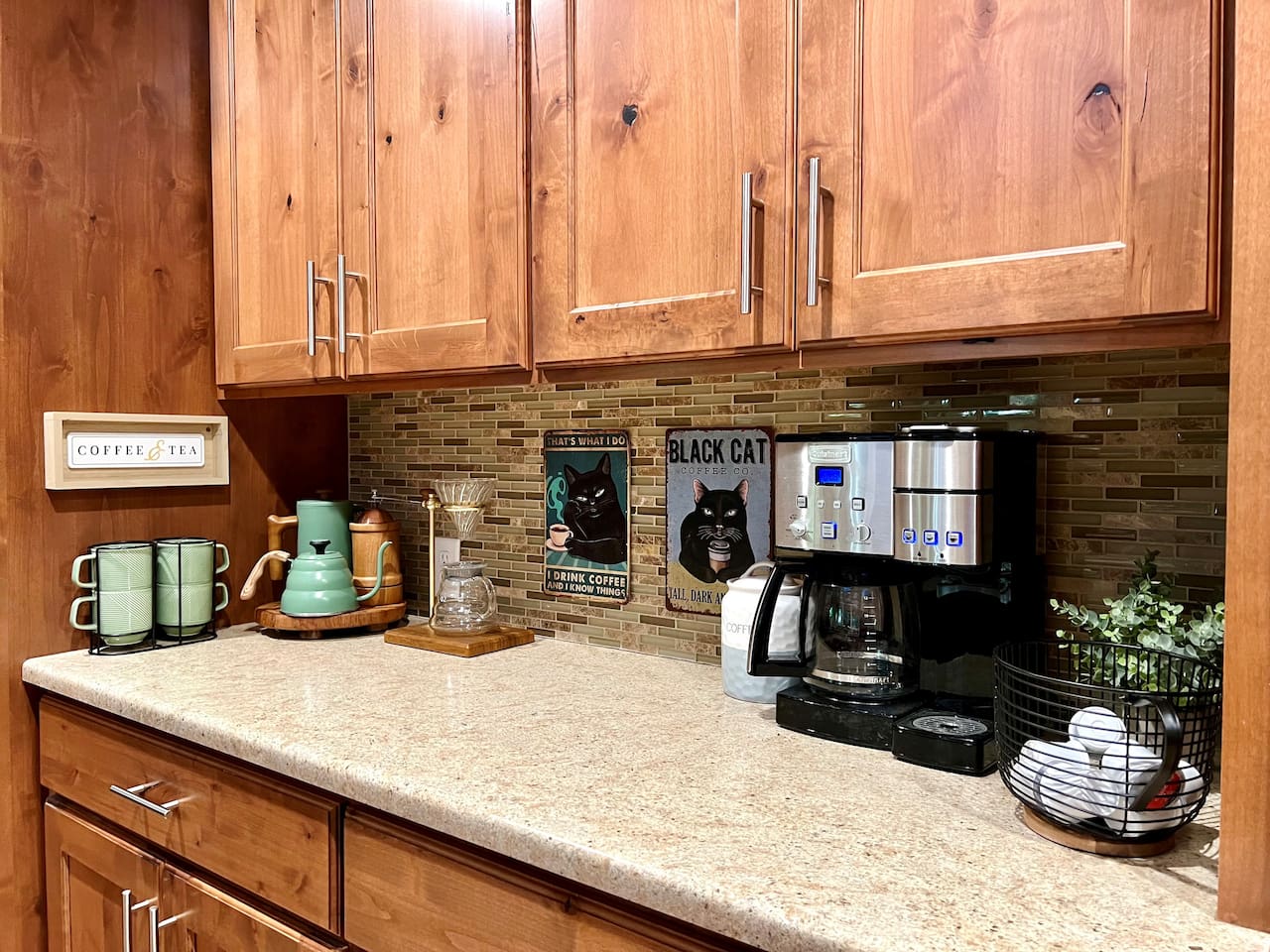 Kitchen coffee area includes drip coffee maker, K-cup maker, French press, and poor over coffee stand