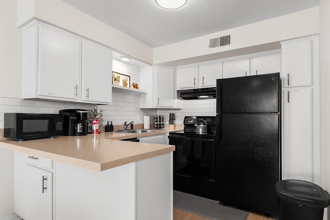 Fully equipped kitchen featuring full-size appliances and everything needed for home-cooked meals.