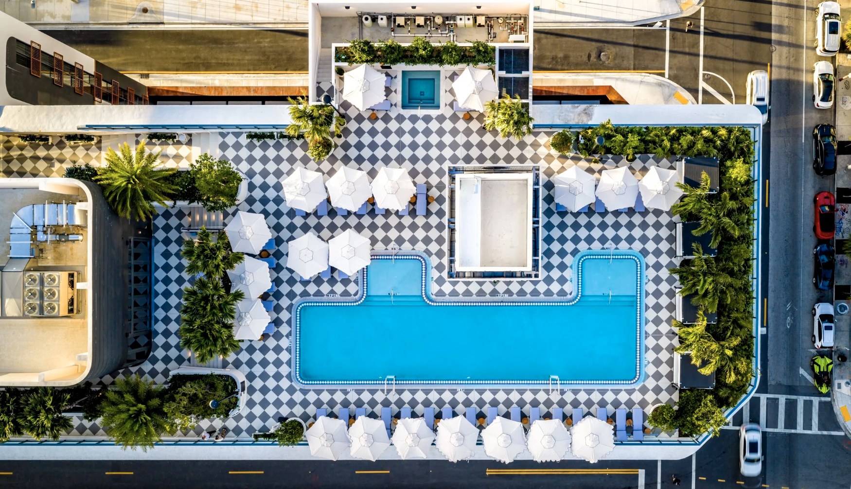 Rooftop oasis — heated lap pool with sun deck and Wynwood city panorama