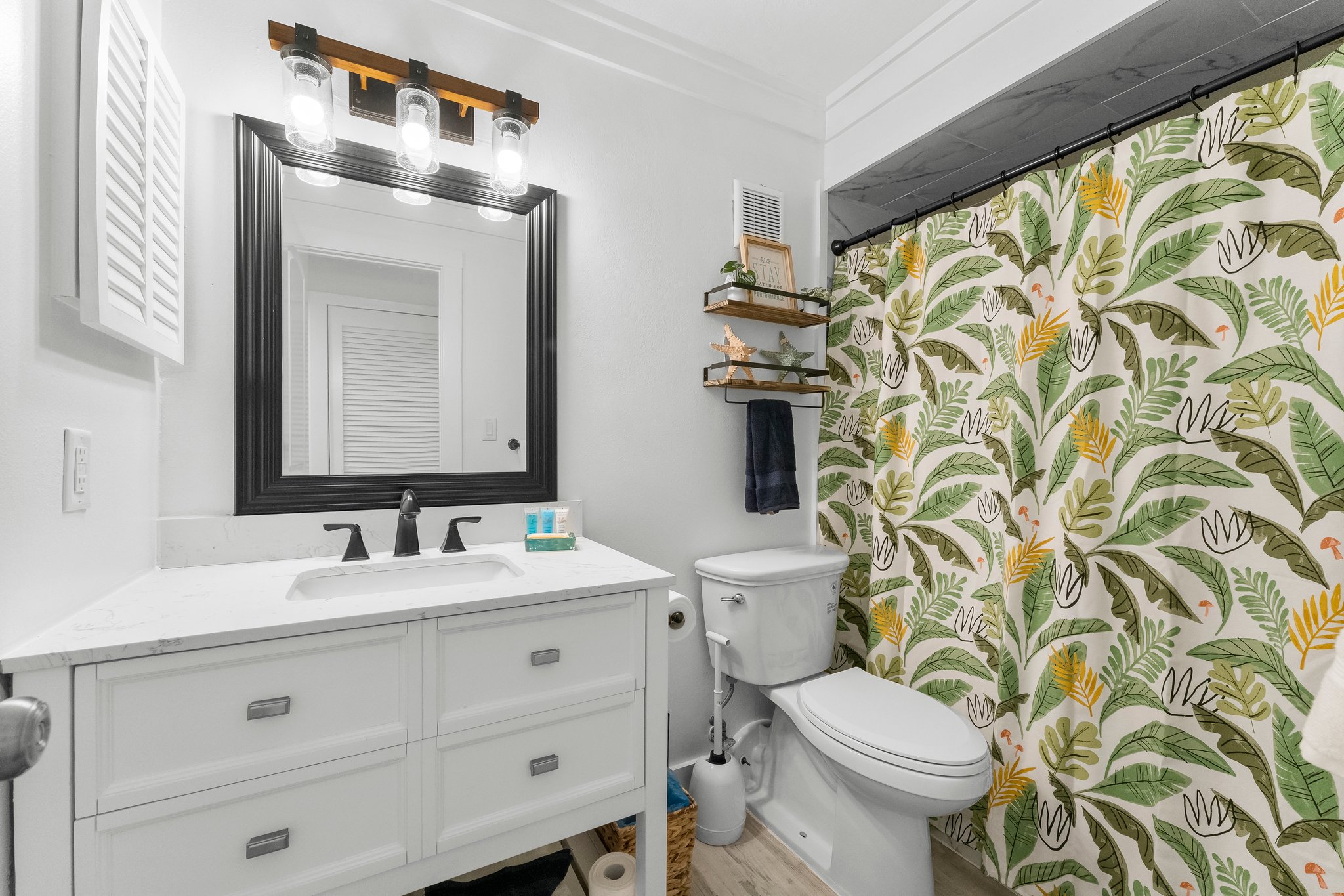 Your guests can start their day feeling rejuvenated or prepare for a night on the town in our coastal-inspired master suite.