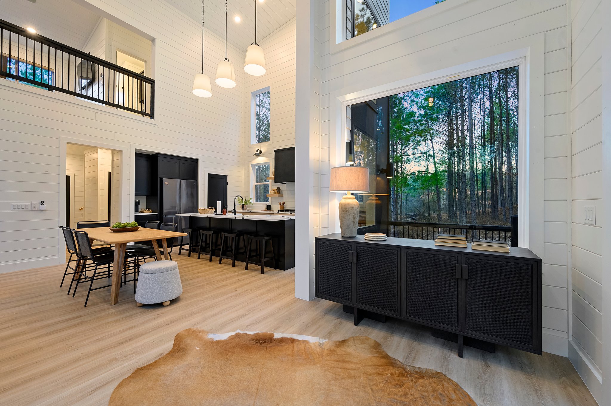 Large picture windows bring the outdoors in, offering peaceful woodland views while you cook.