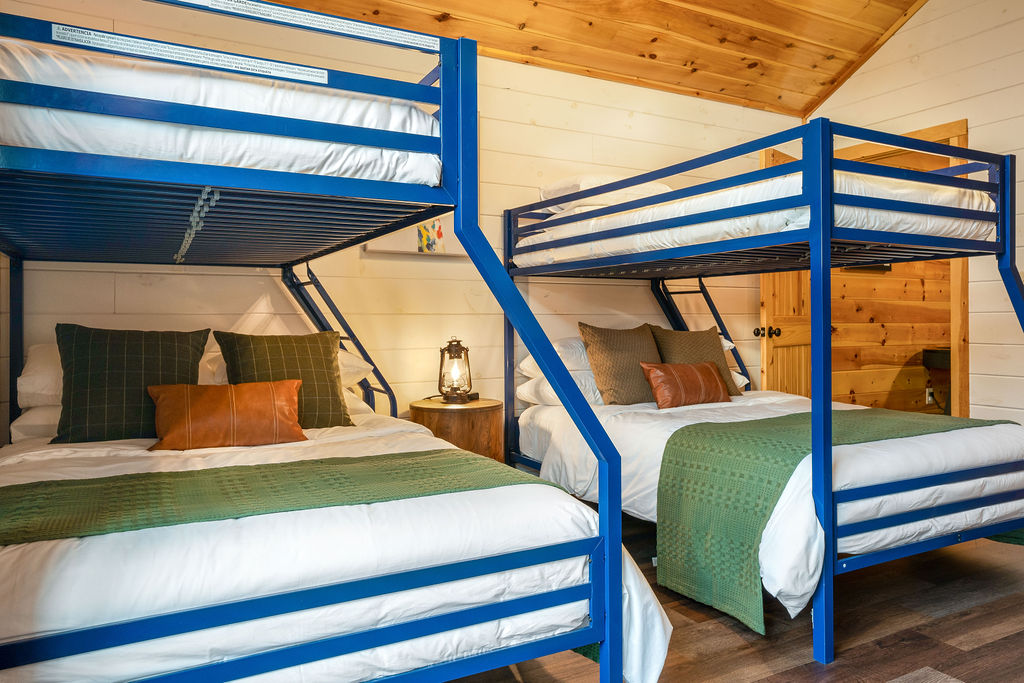 Bunk room with two full over twin bunk beds for the kids