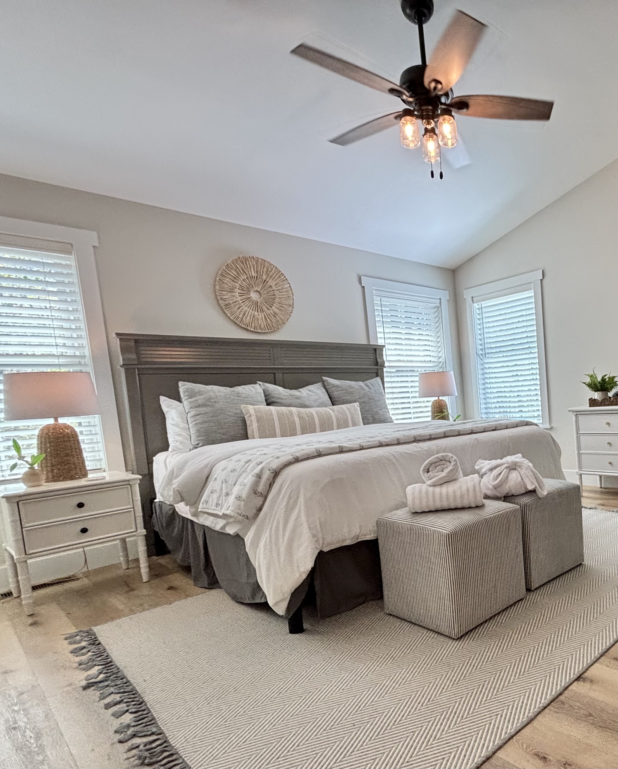 Welcome to your serene getaway! This beautifully designed bedroom features a cozy fireplace and 50" LED TV, vaulted ceilings, stylish decor, and a touch of modern elegance. Perfect for relaxation after a day of adventures. Your tranquil escape awaits!