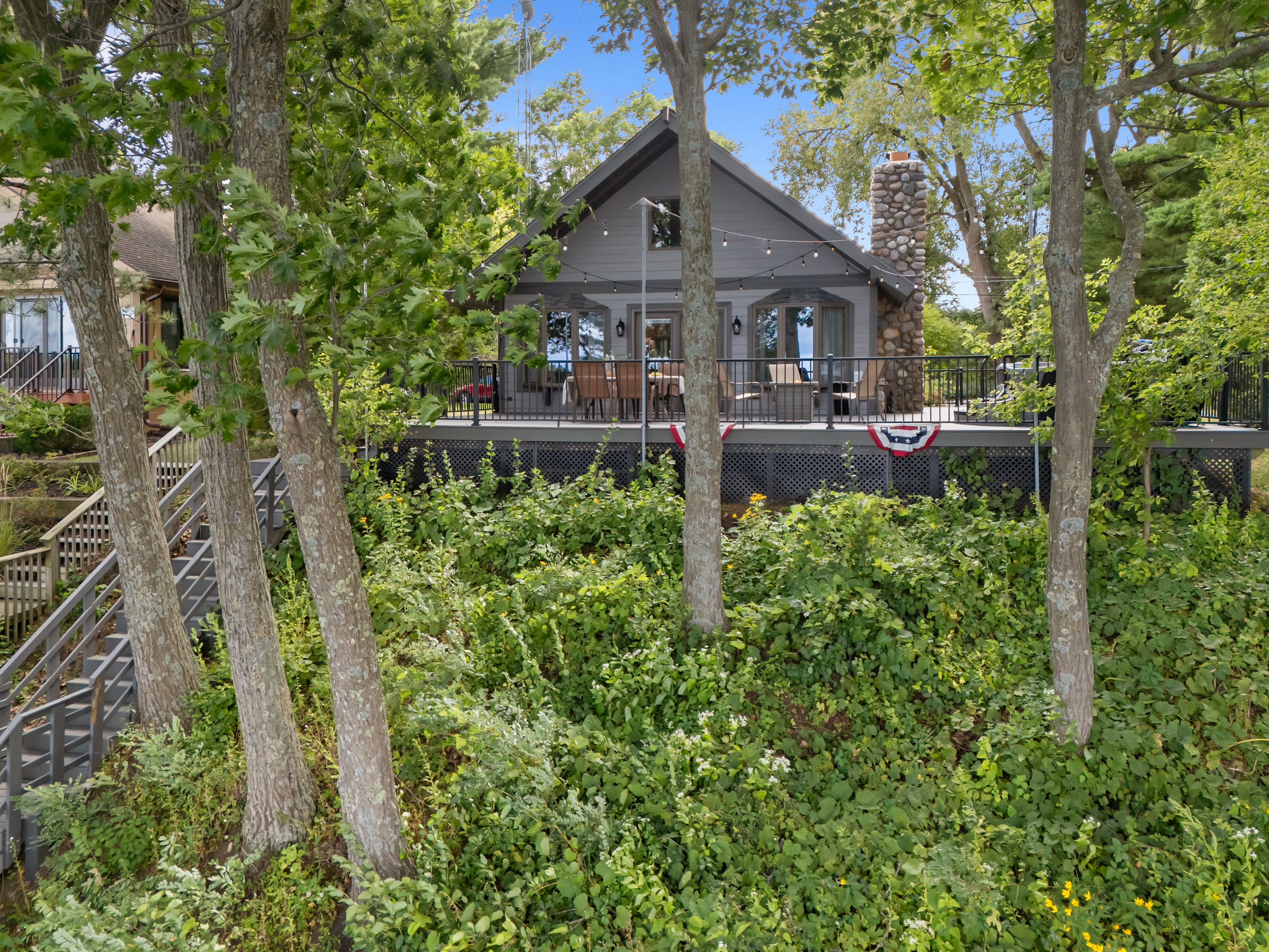 From the deck, enjoy your privacy while still taking in the lake views and water activities below.
