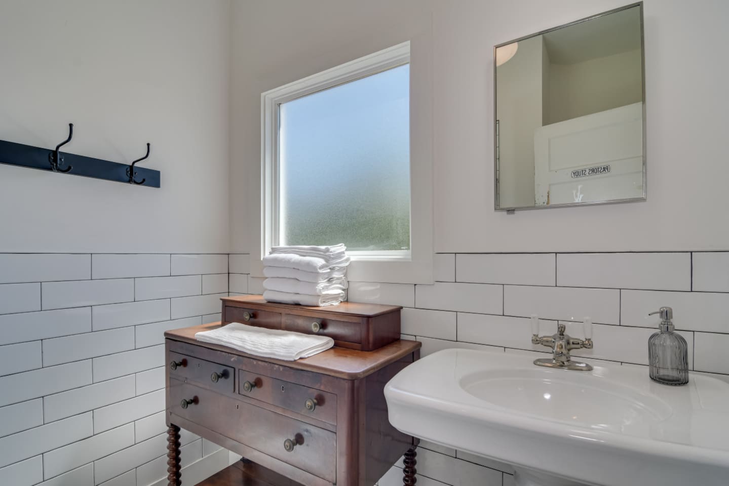 Modern bathroom with bright vanity and clean design.
