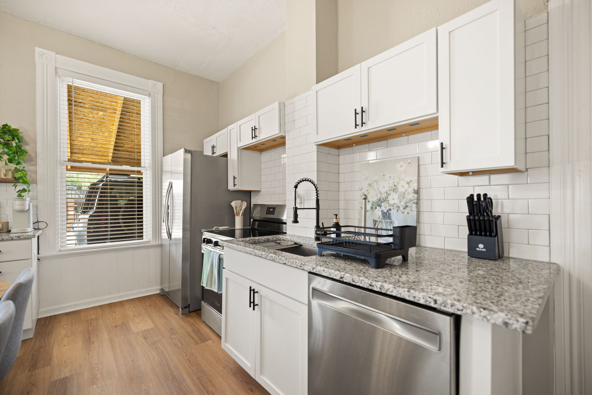 Enjoy an updated kitchen showcasing granite countertops, stainless steel appliances, and abundant cabinet storage