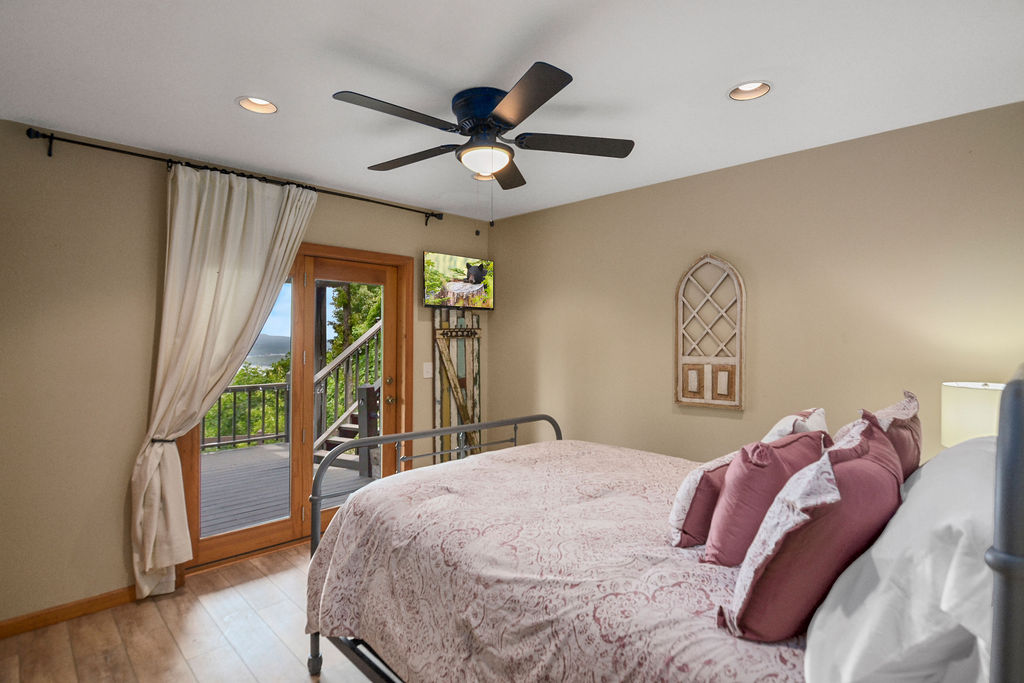 Queen Bedroom with Walkout to Amazing Lake Views