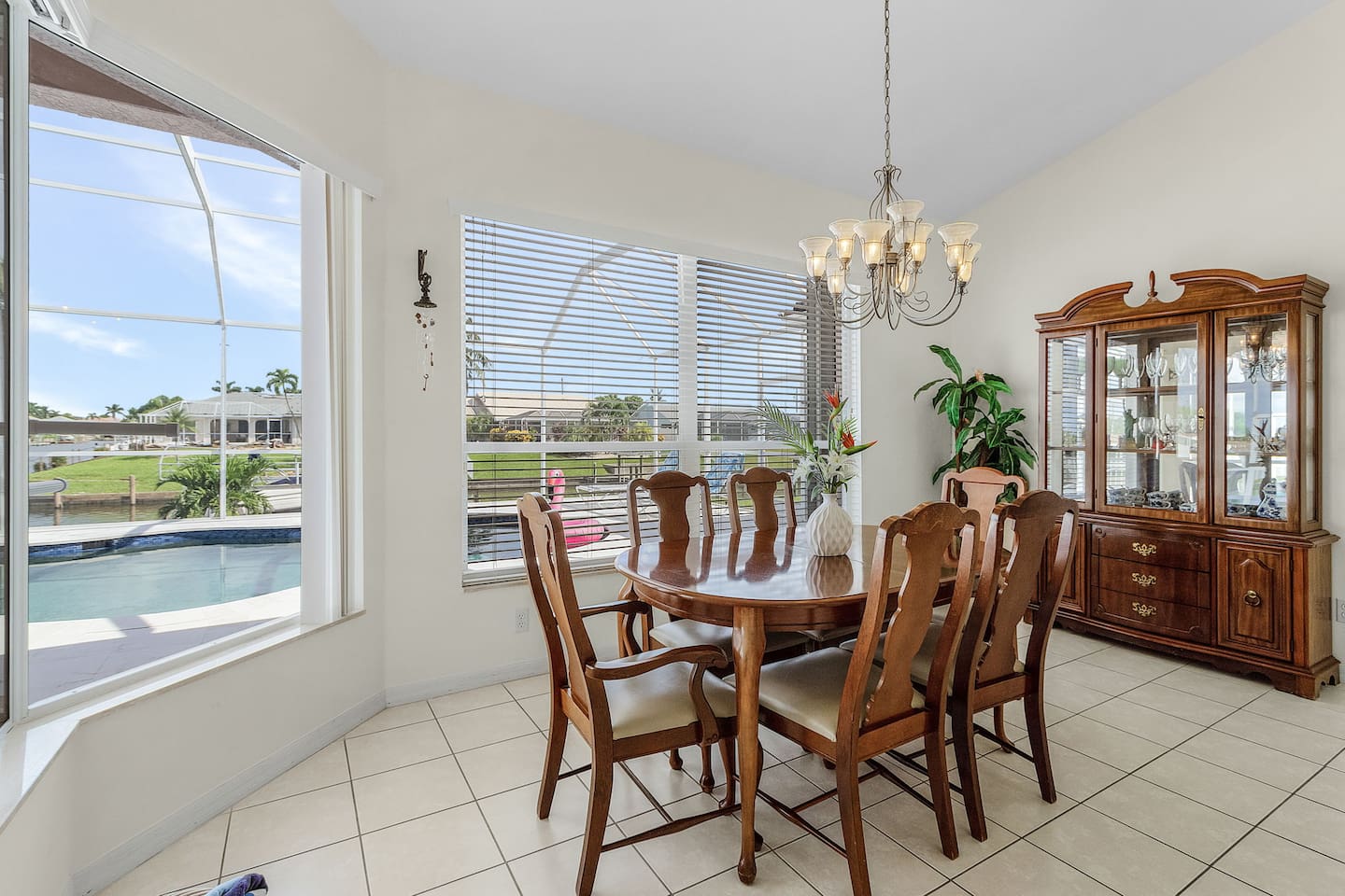 Dining area seats up to 6, offering stunning views of the water, pool, and lanai area!