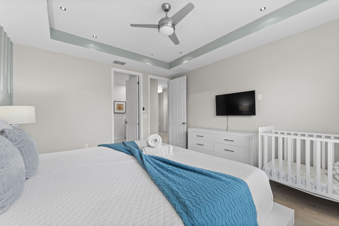 First Floor - This stunning king bedroom is perfect for families, featuring a cozy crib for your little one