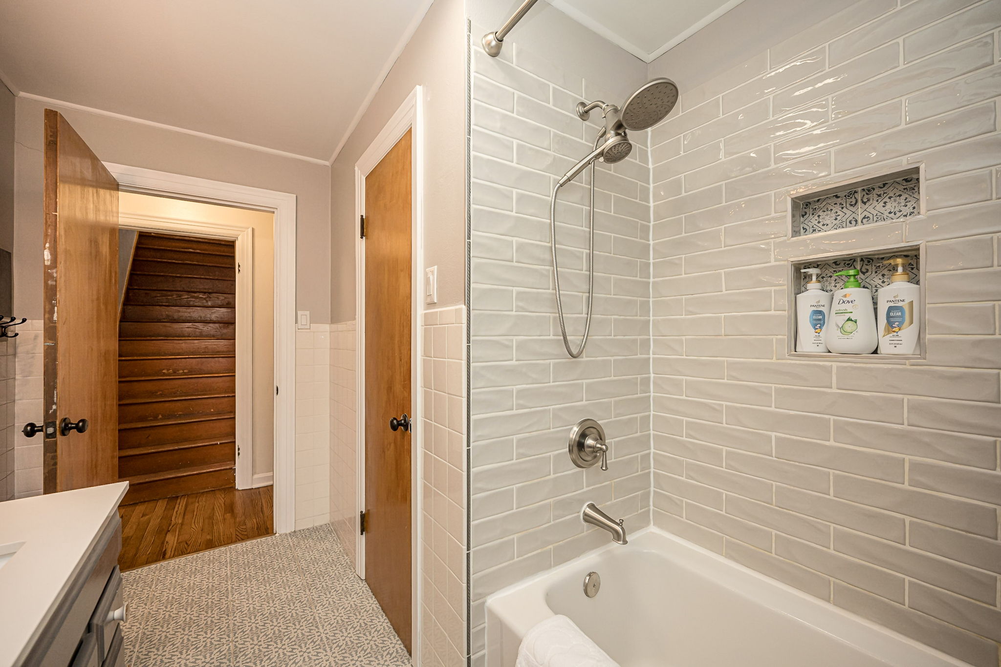 Fresh towels and complimentary toiletries are provided.