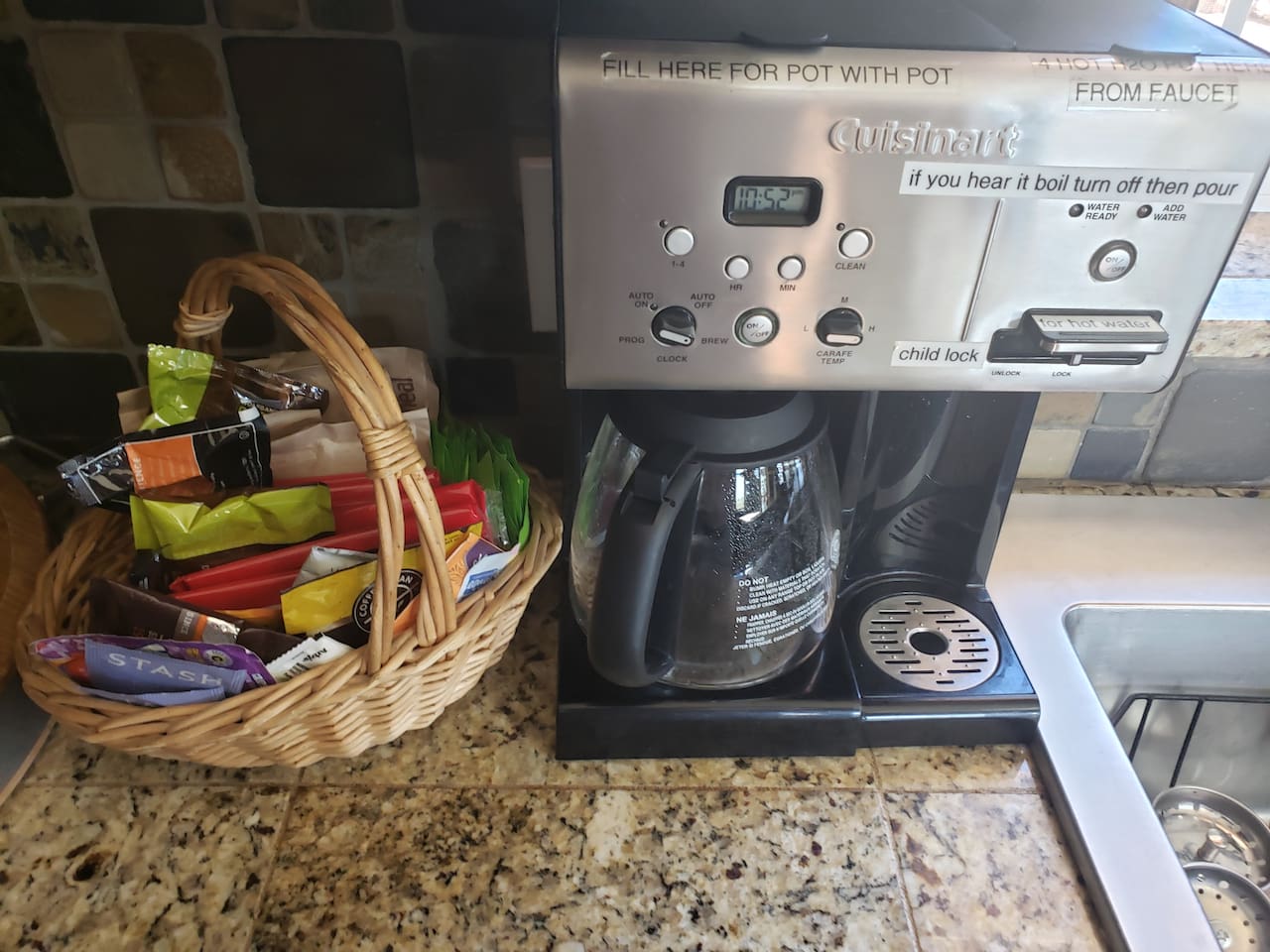 Standard coffee maker (has reusable gold filter) with hot water function for the hot tea drinkers.  An assortment of items you may have forgotten is provided "just in case".
