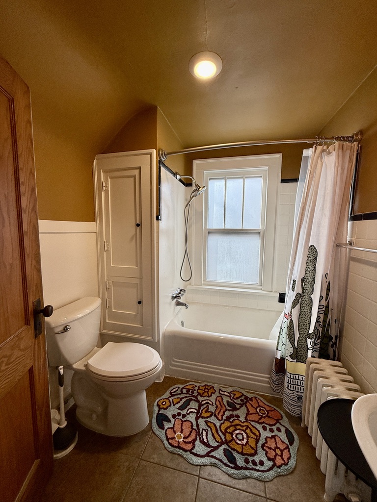 Updated shower fixtures with good water pressure, plus built-ins for towels and bathroom essentials.