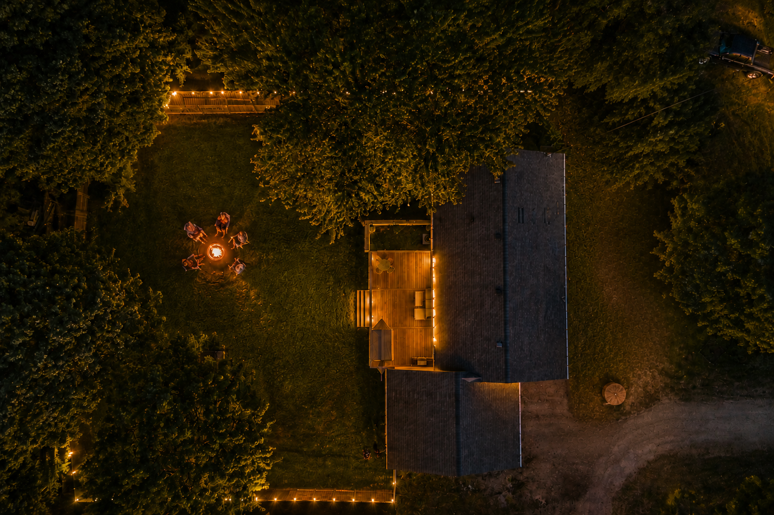 Crackling fires and room to unwind under the trees. This private backyard retreat is made for slow evenings, s’mores, and Northern Michigan memories.