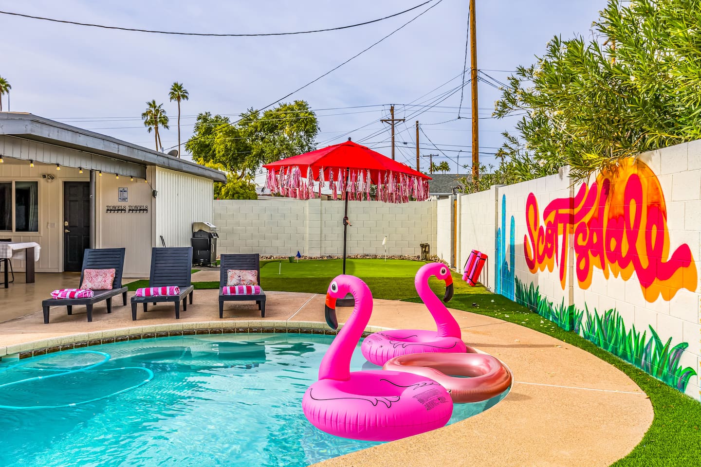 Stretch out on comfy loungers under a festive umbrella—just steps from your private pool and hot tub oasis.

