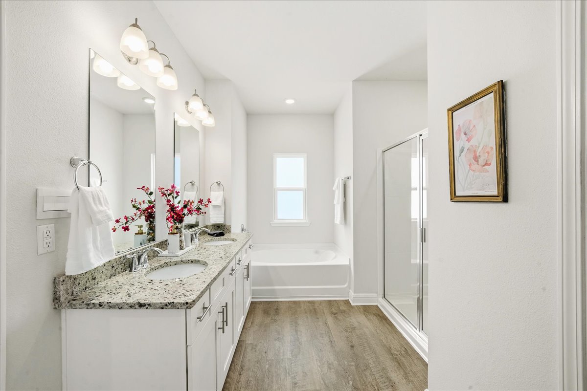 Primary bathroom: Dual sinks with Soaking tub and walk in shower

