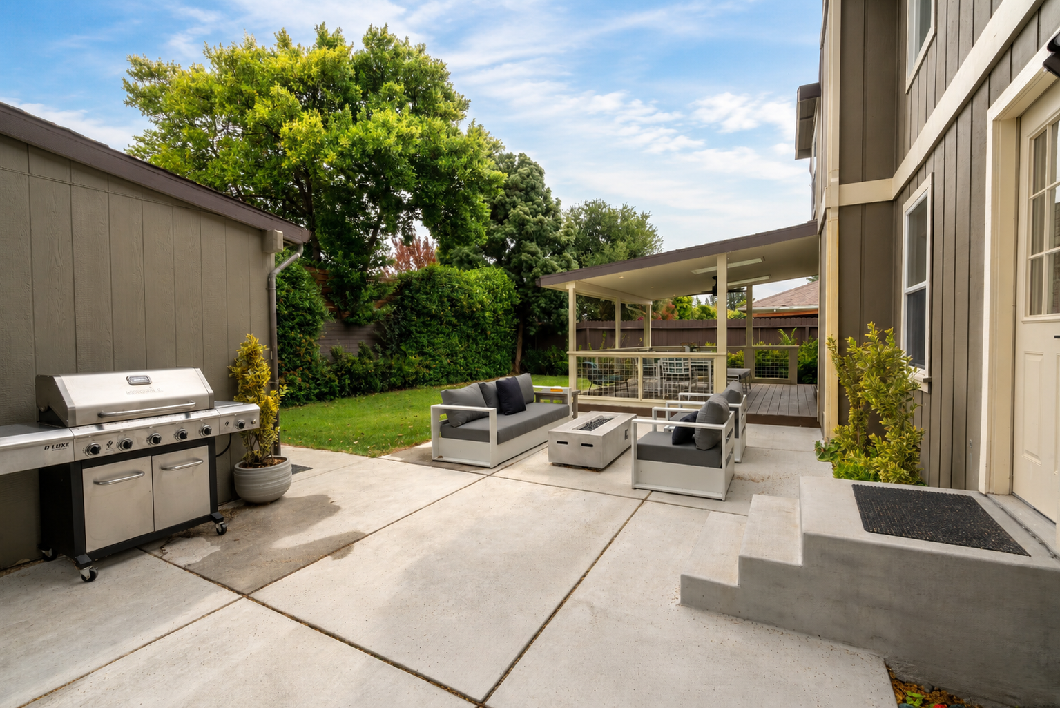 Outdoor seating for 5 with fire pit and BBQ grill