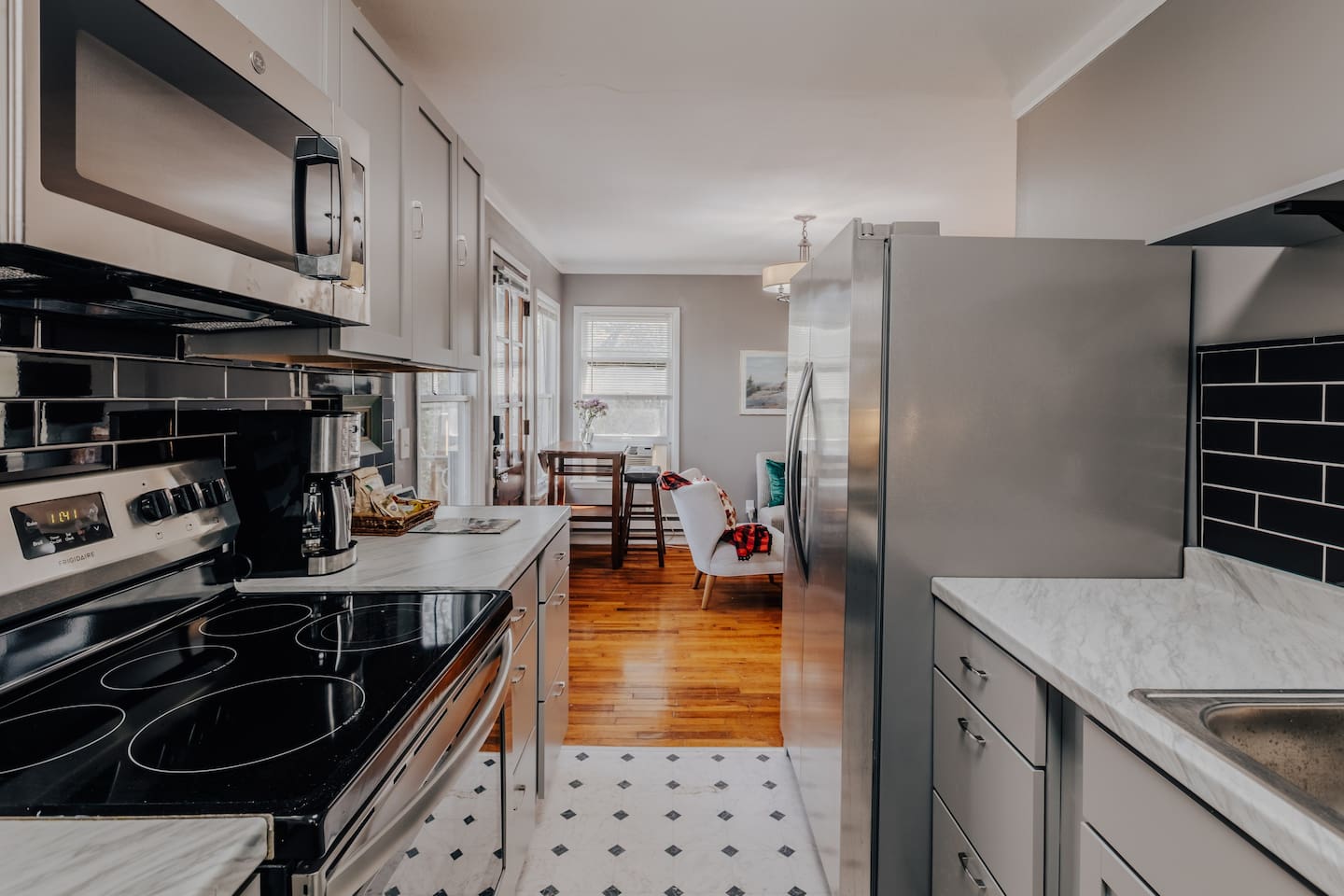 house 1 kitchen, just renovated with frig, stove. microwave. cook top and fully stocked with cookingware