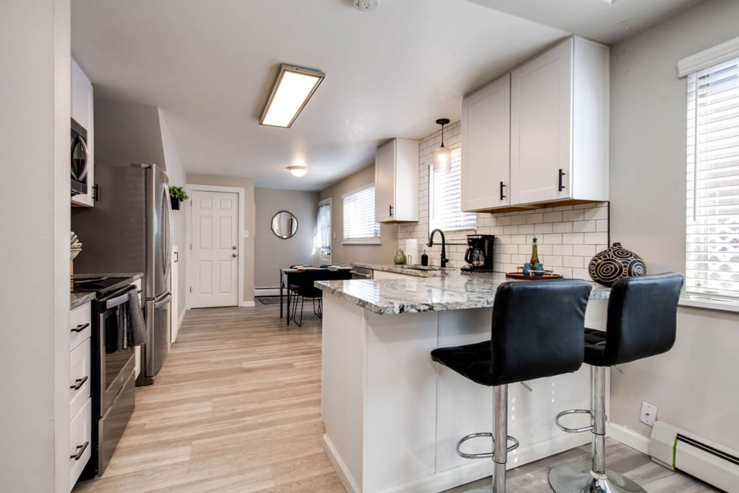 Breakfast bar and dining table accomodate you and your guests dining needs